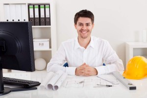 Confident young architect in his office