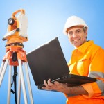 Senior land surveyor with theodelite