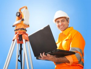 Senior land surveyor with theodelite