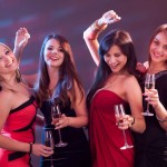 Stylish women toasting with champagne