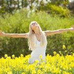 Young Woman Standing In Field