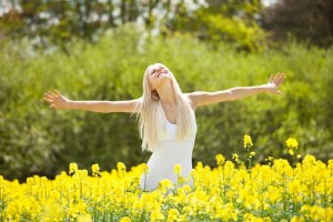 Young Woman Standing In Field