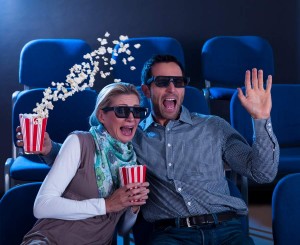 Couple reacting in shock to a 3D movie