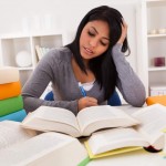 Portrait Of Young Woman Studying